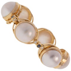 Mabe' Pearl Bracelet 18k Yellow Gold with Diamonds and Sapphires 50.70 Grams