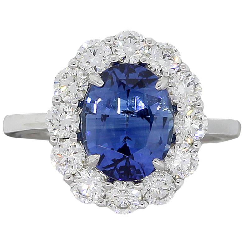 GIA Certified 3.48 Carat Oval Sapphire and Diamond Halo Ring