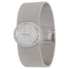 Montre-bracelet large et lourde en or blanc 14 carats avec diamants pour femmes