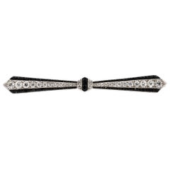 Antique Cartier Art Deco Platinum Onyx Diamond Bow Pin