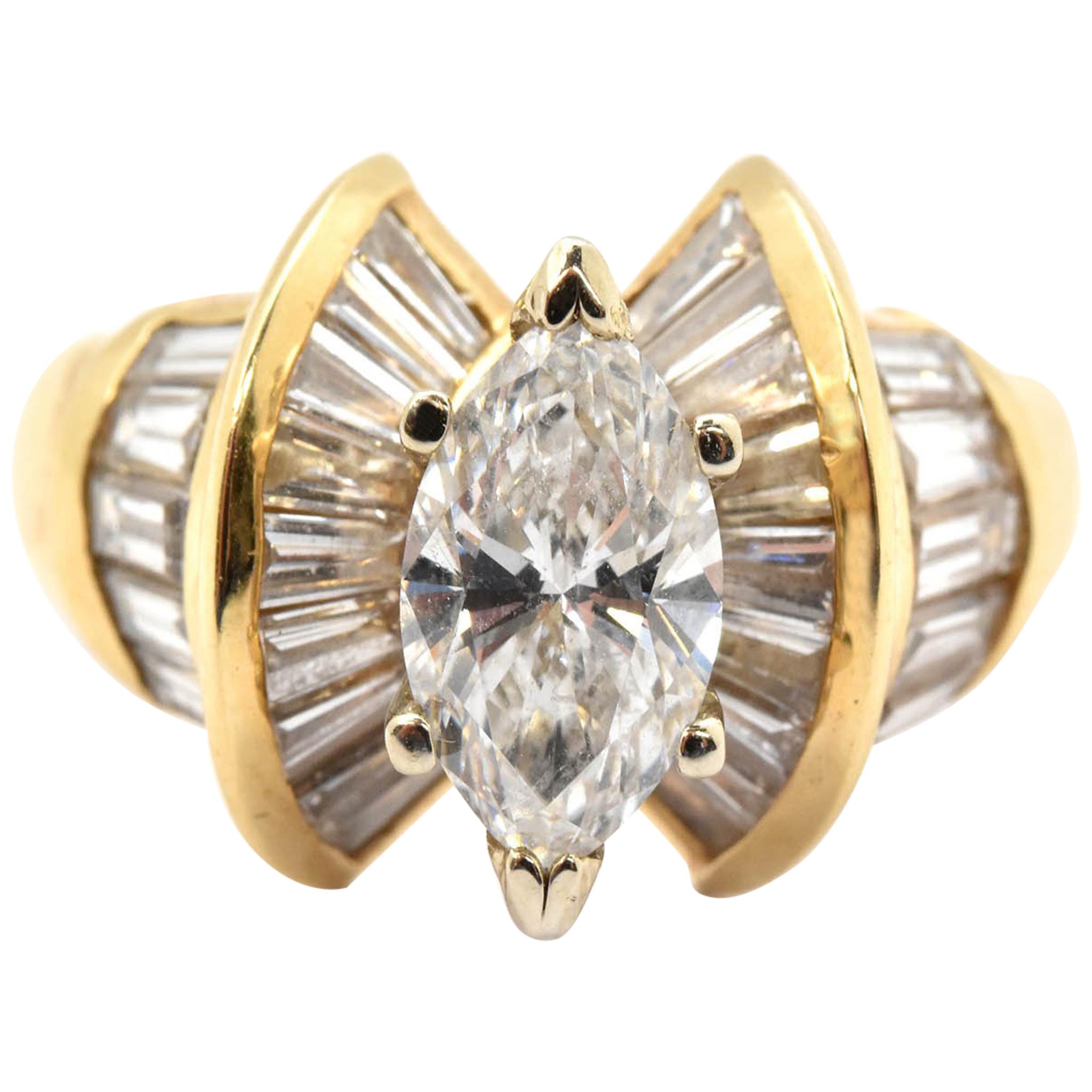 14 Karat Yellow Gold and EGL 1.20 Carat Marquise Diamond Ring with Baguettes