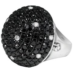 Dome Shaped Black White Diamond Ring Set in 18 Carat White Gold