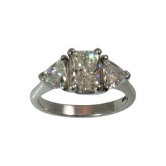 Platinum Ring with Radiant Cut Diamond and Diamond Trilliants