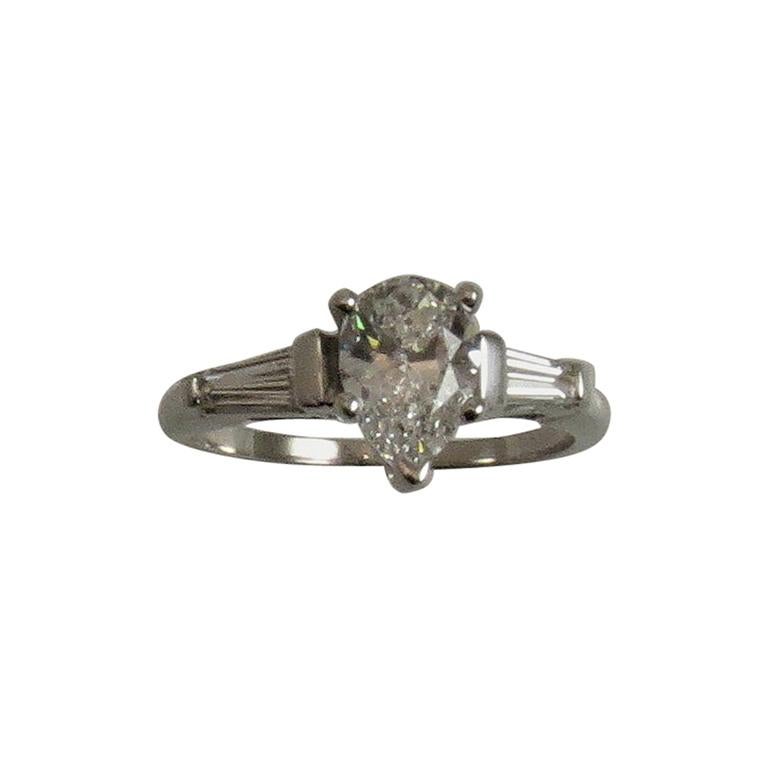 Platinum Engagement Ring Prong Set with Pear Shape Diamond and Baguettes For Sale