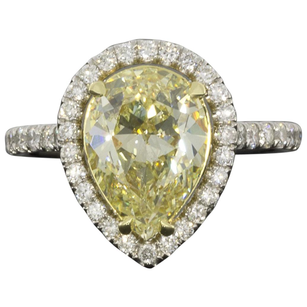 Platinum and Gold Fancy Yellow Pear Diamond EGL Certified Halo Engagement Ring