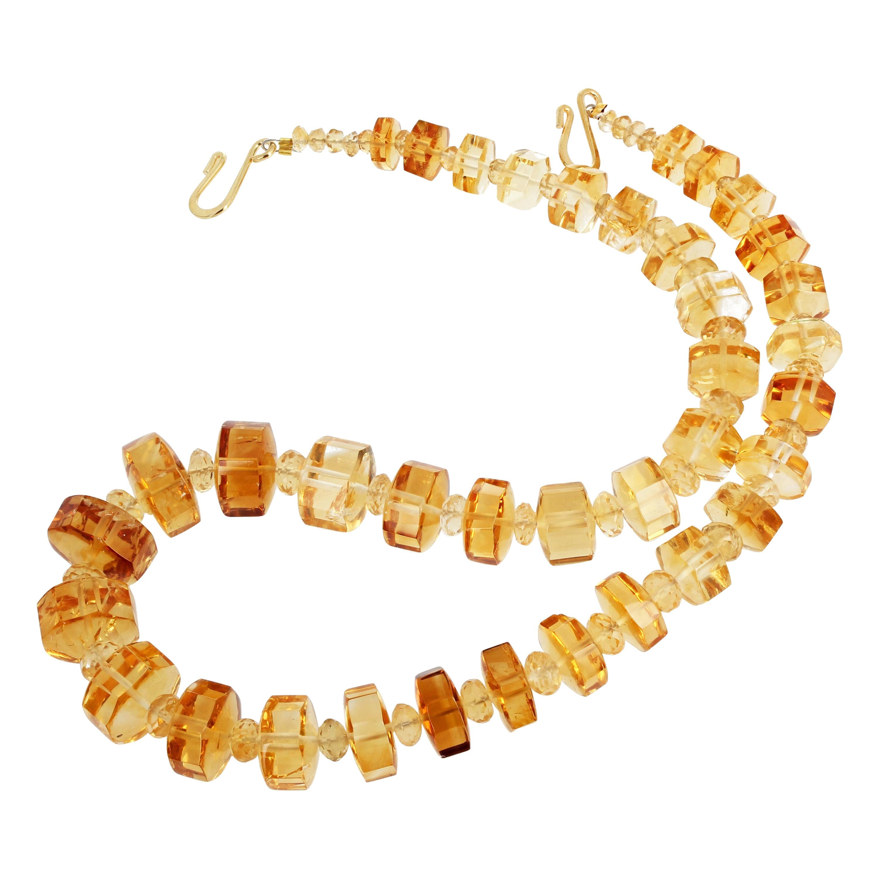 Glittering crazy cut - 6 sided - Citrines (the largest approximately 15 mm) enhanced with smaller faceted sparkling Citrines in a necklace 17 inches long with a gold tone hook clasp. 