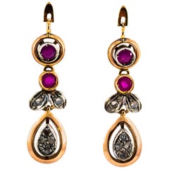 Pendientes de oro amarillo de 0,40 quilates de rubí y 0,12 quilates de diamante blanco