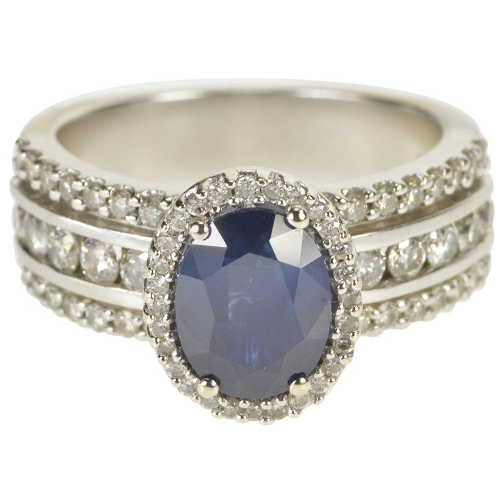 Oval Sapphire Diamond Halo Engagement Ring