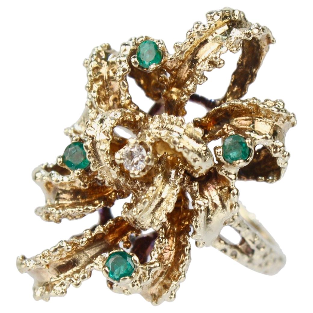 Brutalist 14 Karat Gold Emerald and Diamond Bow Form Cocktail Ring For Sale