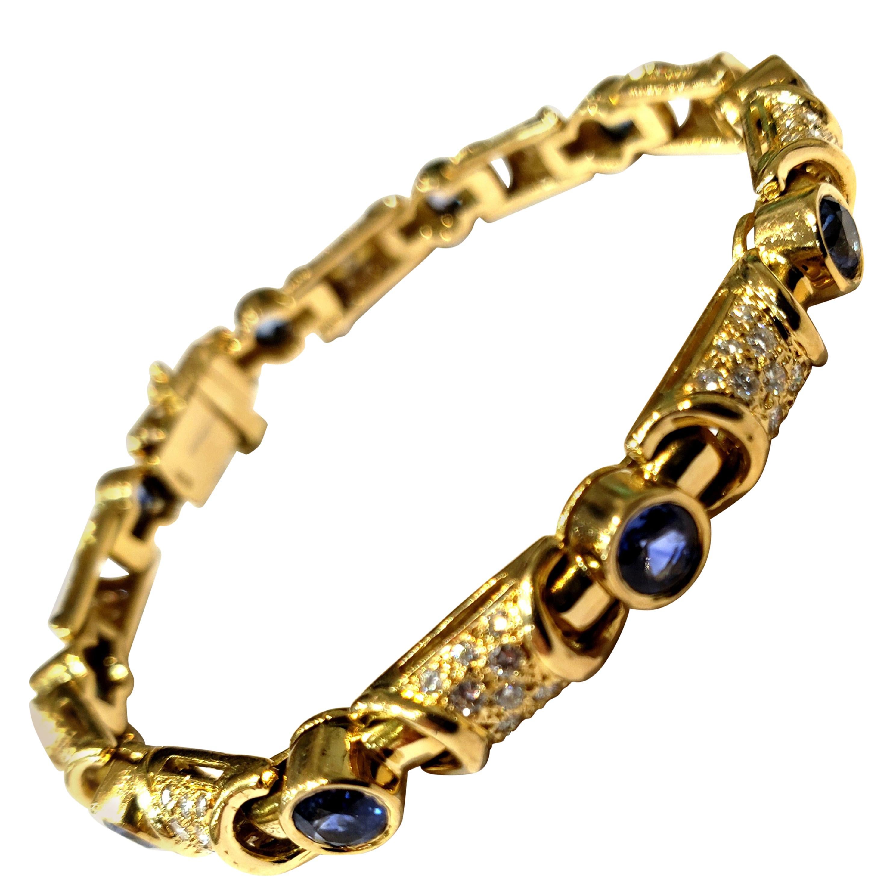 18 Karat Yellow Gold and Diamond Link Bracelet with Bezel Set Blue Sapphires For Sale