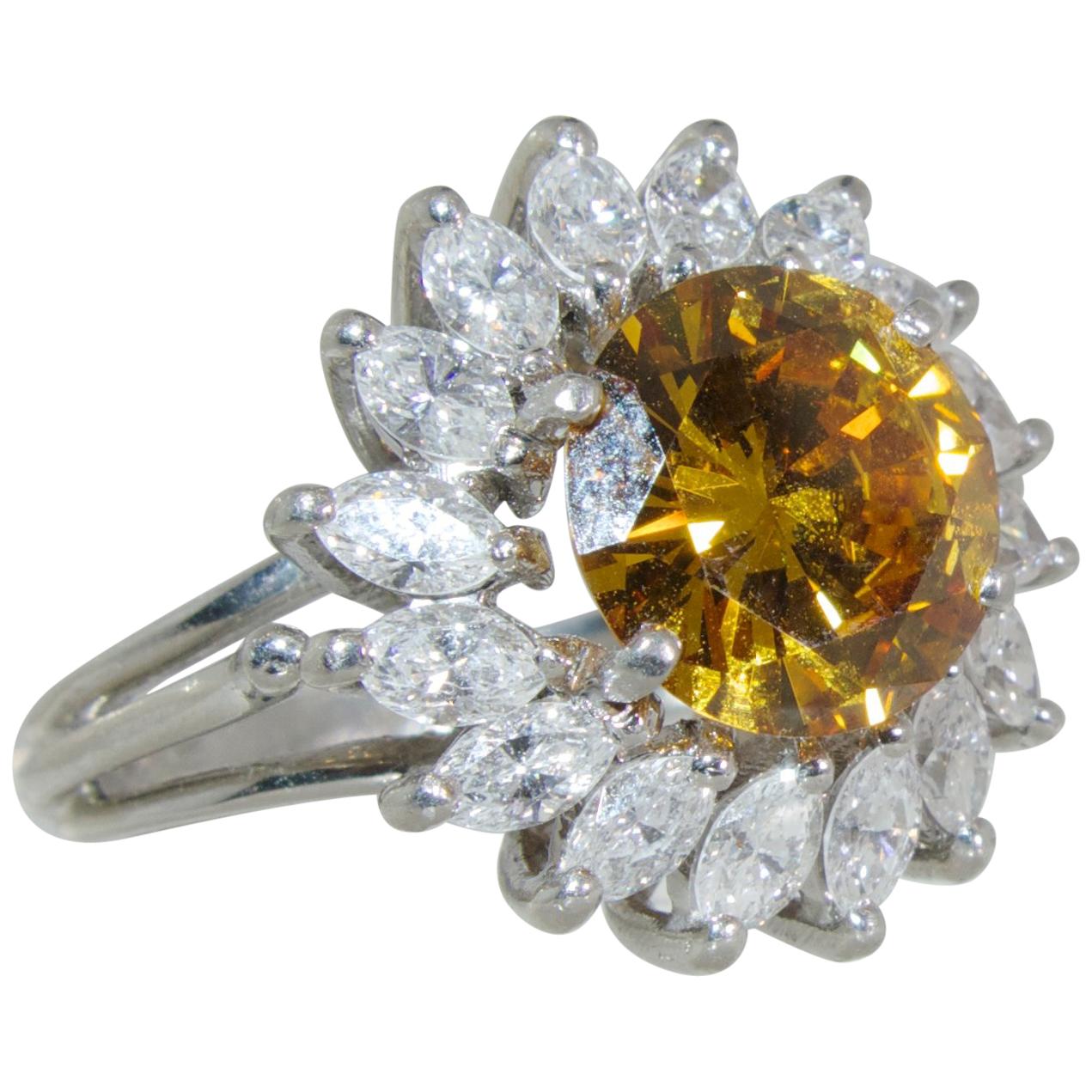  Fancy color Diamond, 2.68 cts  surrounded by White Diamond in a Platinum Ring