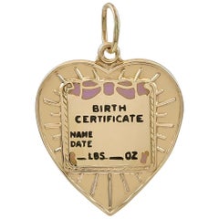Gold and Enamel Birth Certificate Charm