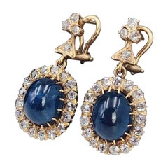 18 Karat Gold Oval Cabochon Sapphire Circular cut Diamond Cluster Drop Earrings