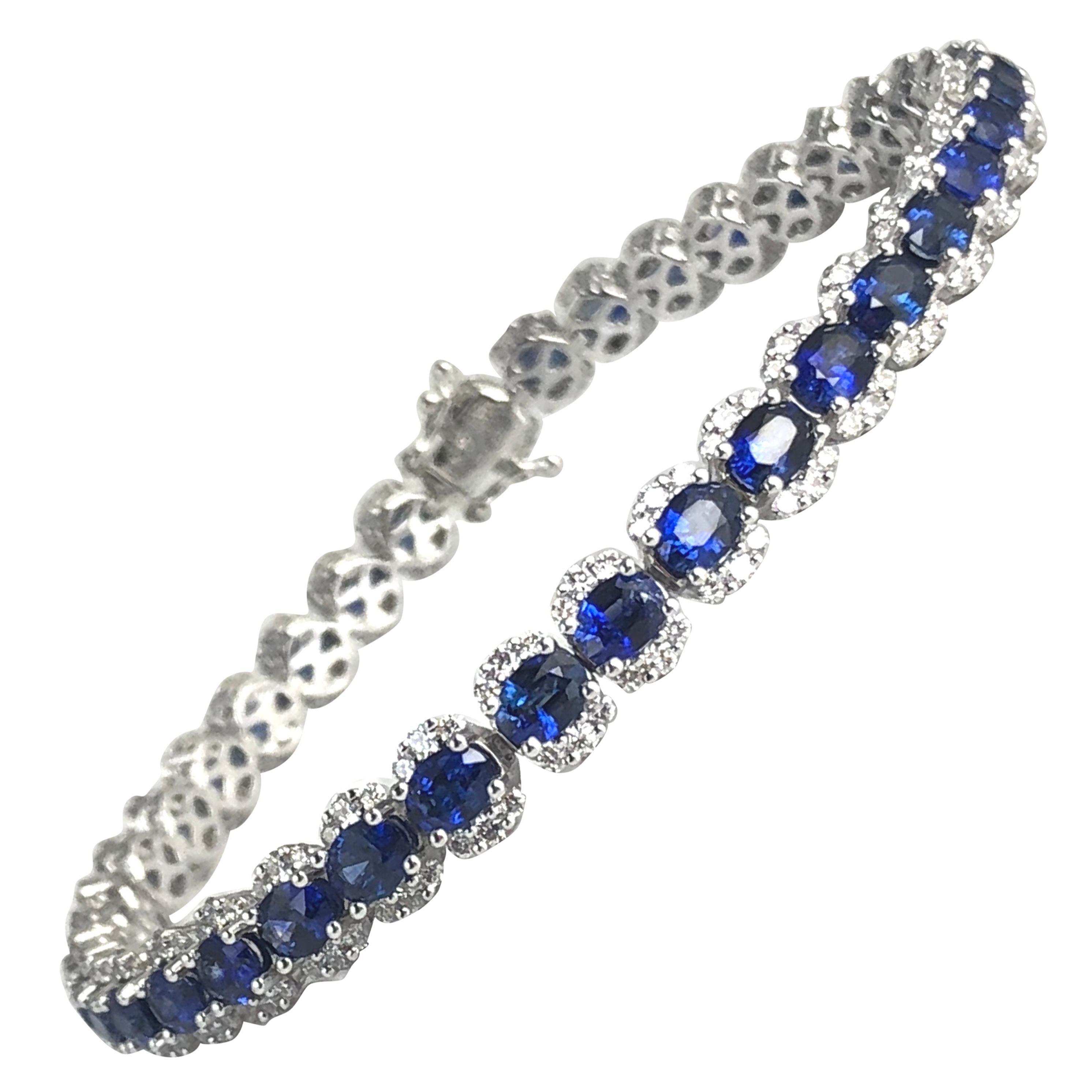 (DiamondTown) This bracelet features 39 oval cut sapphires (total weight 7.64 carats) inside a halo of round white diamonds (total diamond weight 1.87 carats). Set in 18k White Gold

Bracelet measures 7