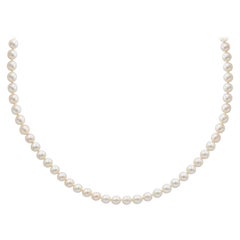 White Pearls Necklace with a Clasp, Features Round Diamonds