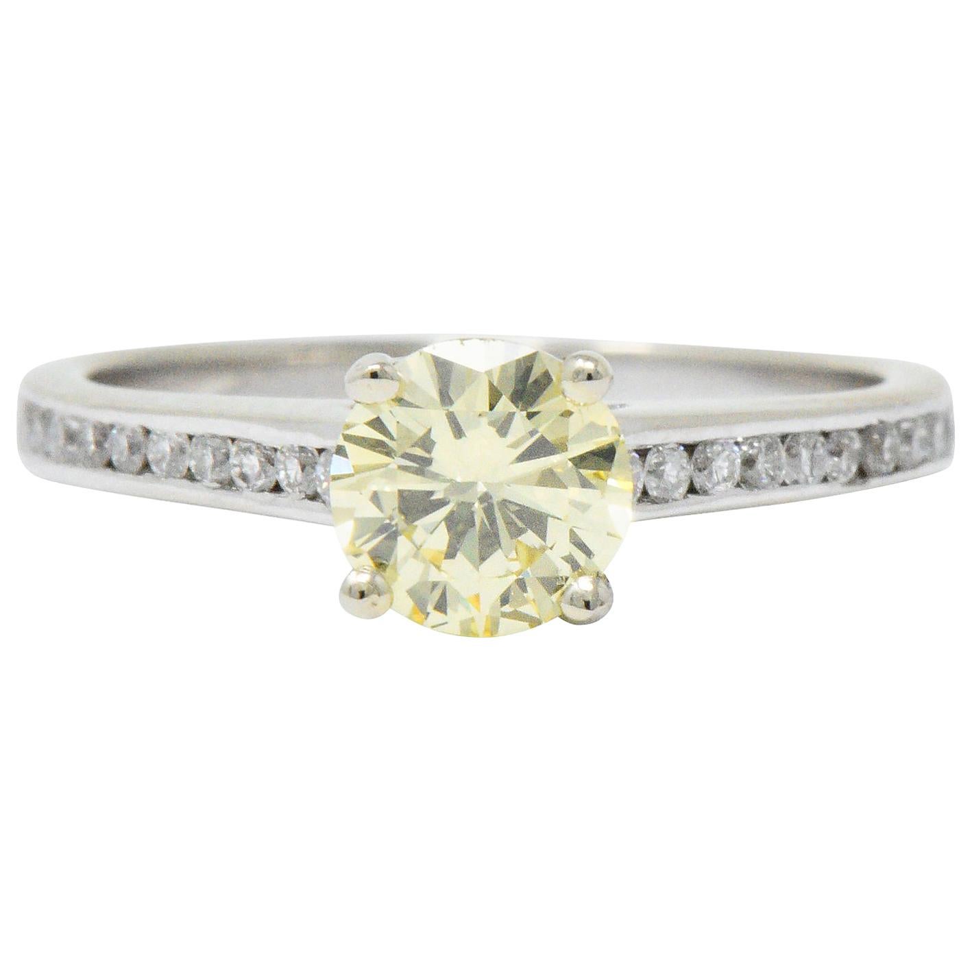 Modern 0.79 Carat Fancy Yellow Diamond 14 Karat White Gold Engagement Ring GIA