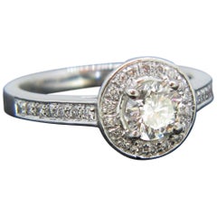 Modern 0.63 Carat Diamond Halo Cluster Platinum Engagement Ring