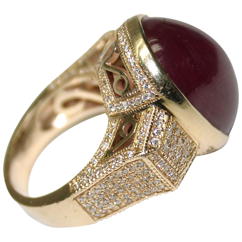 14 Karat Yellow Gold Ladies Oval Shaped Cabochon Ruby and Diamond Ring