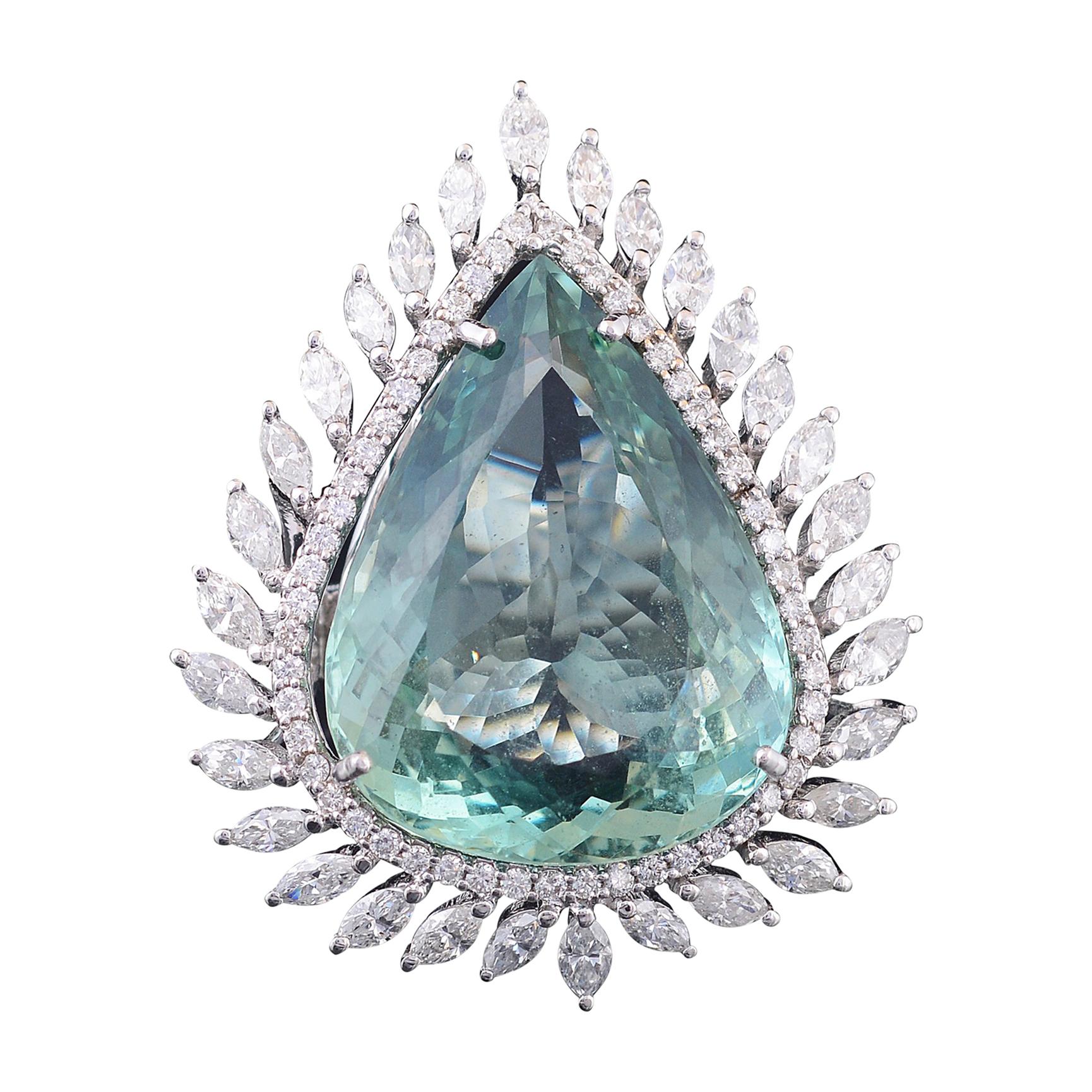 Set in 18K gold, pear shaped green aquamarine and marquise diamond cocktail ring
