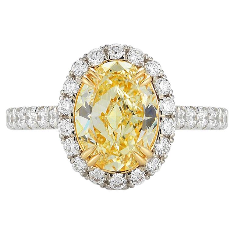 Fancy Yellow Oval Cut Halo Set Diamond Engagement Ring in Platinum 2.38 Carat