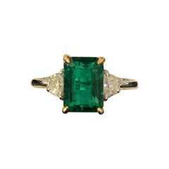 Certified 3.20 Carat Emerald and Diamond Three-Stone Engagement Ring