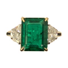 Certified 5.28 Carat Emerald and Diamond Three-Stone Engagement Ring