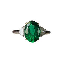 Certified 3.22 Carat Oval Emerald and Diamond Three-Stone Engagement Ring