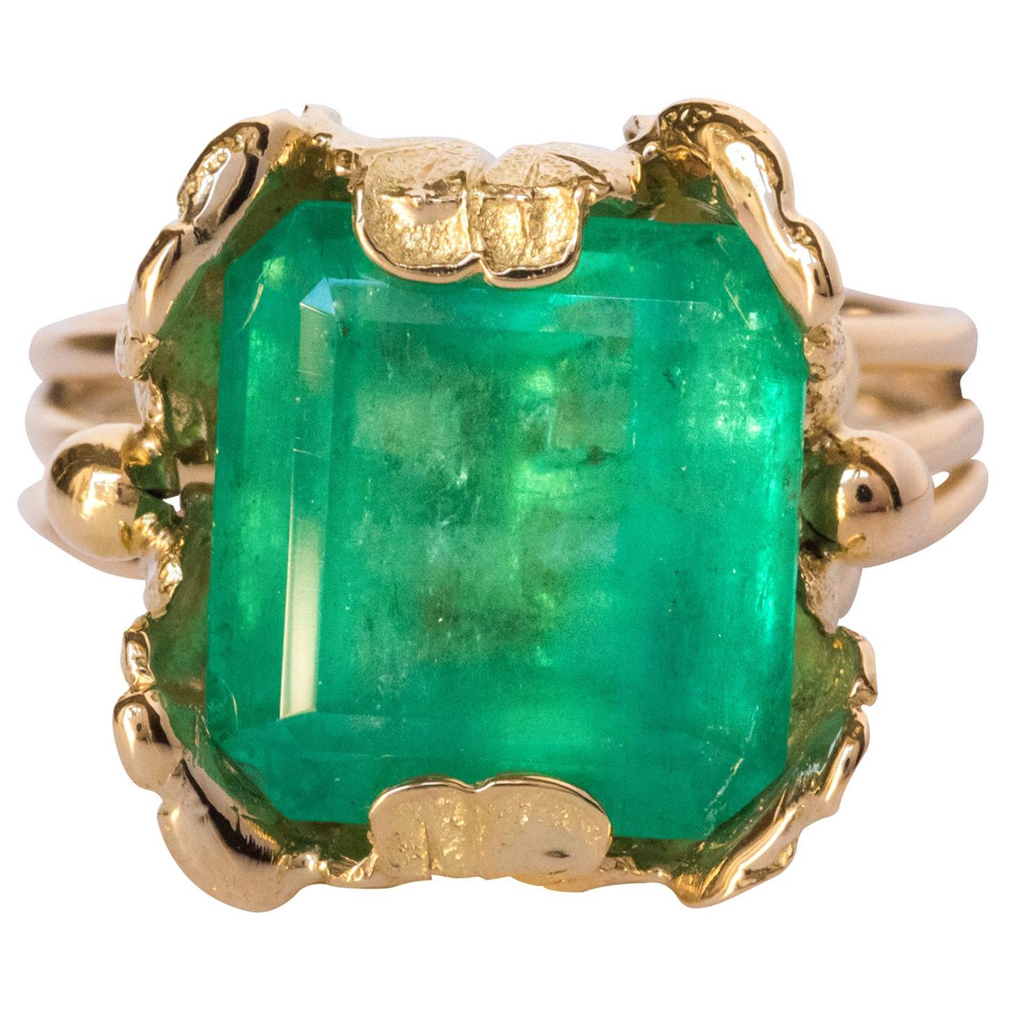 1960s 11.76 Carat Colombian Emerald Foliaged Setting 18 Karat Yellow Gold Ring