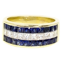 18 Karat Sapphire and Diamond Invisibly Set Ring