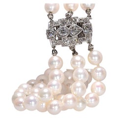 Art Deco Triple Strand Pearl Bracelet with 1.8 Carat TW Platinum Clasp