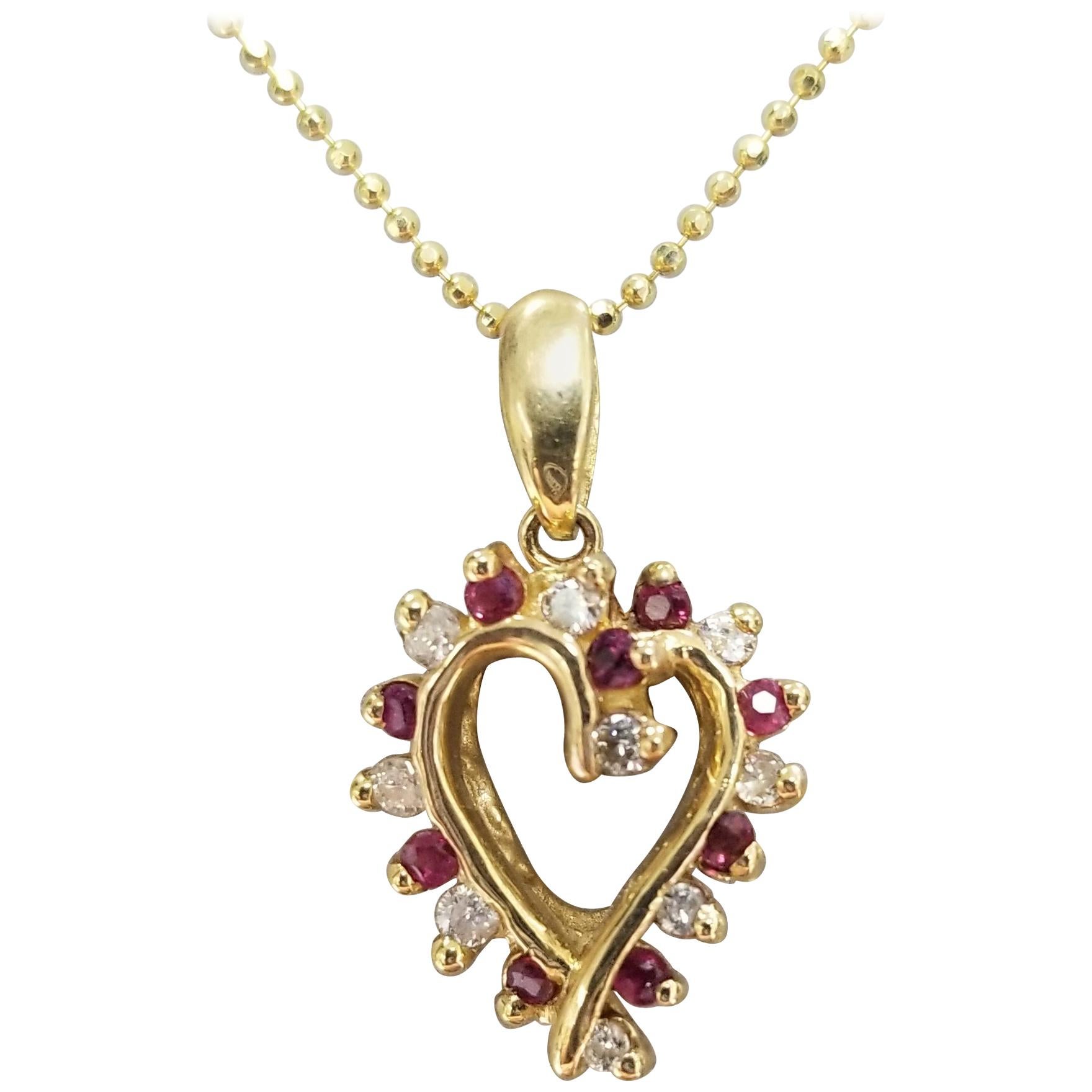 14 Karat Ruby and Diamond Heart For Sale