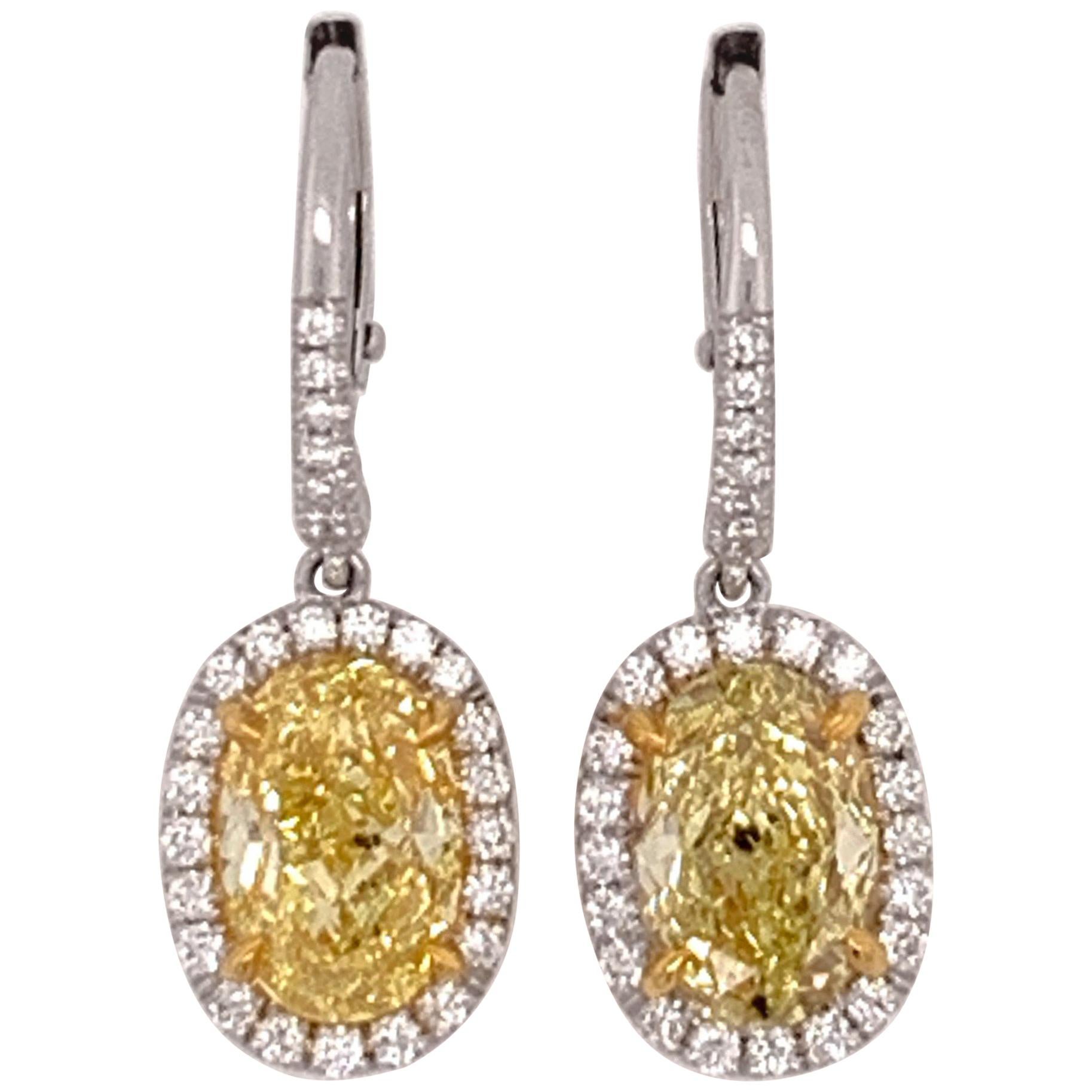 Modern 3.09 Carat Platinum GIA Certified Natural Intense Yellow Diamond Earrings For Sale