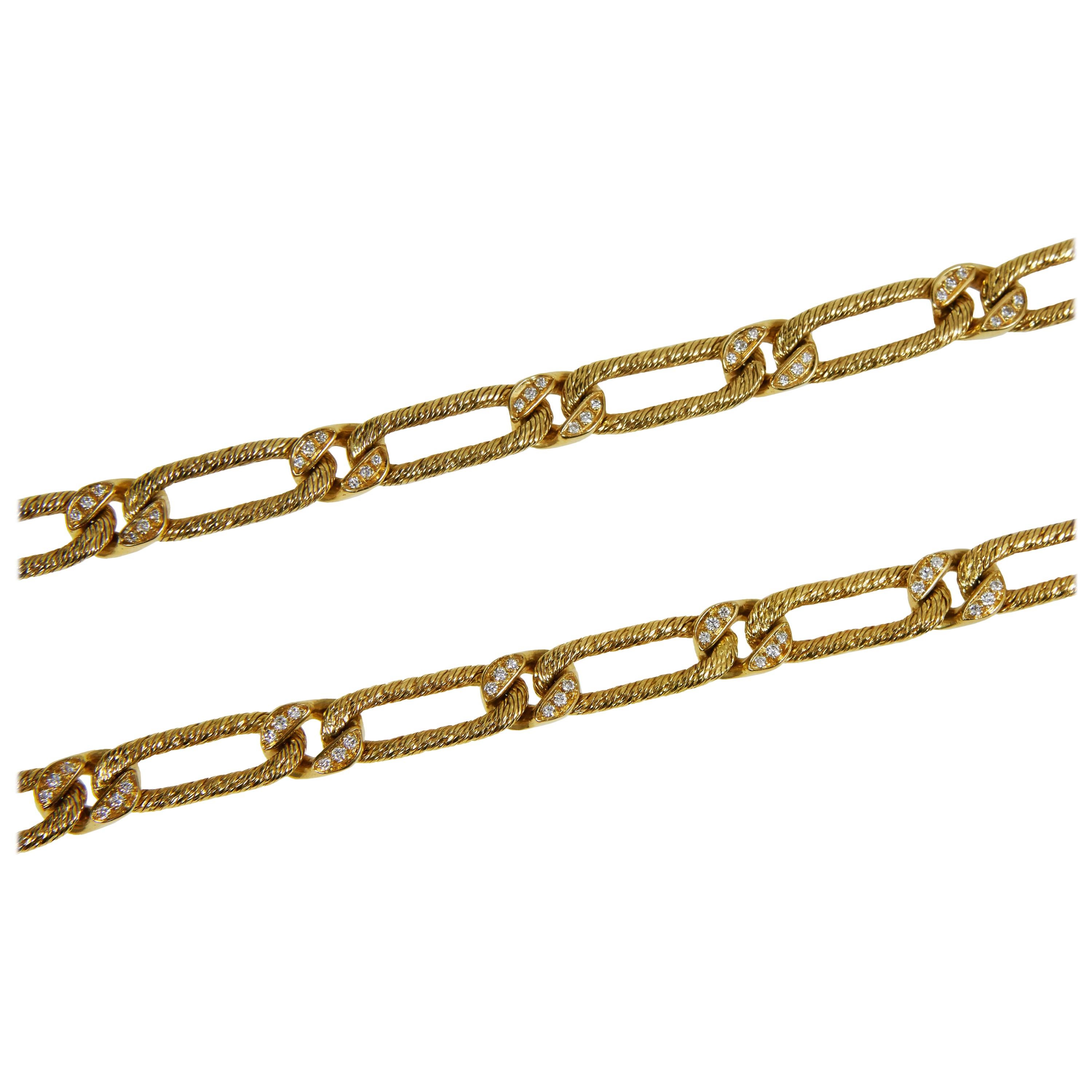 A diamond and braided 18 karat gold chain, with detachable bracelet, by master goldsmiths - and renowned chain makers - Georges L'enfant for Fred Paris, c. 1960

The chain is signed 'Fred' with maker's marks for Georges L'enfant and French