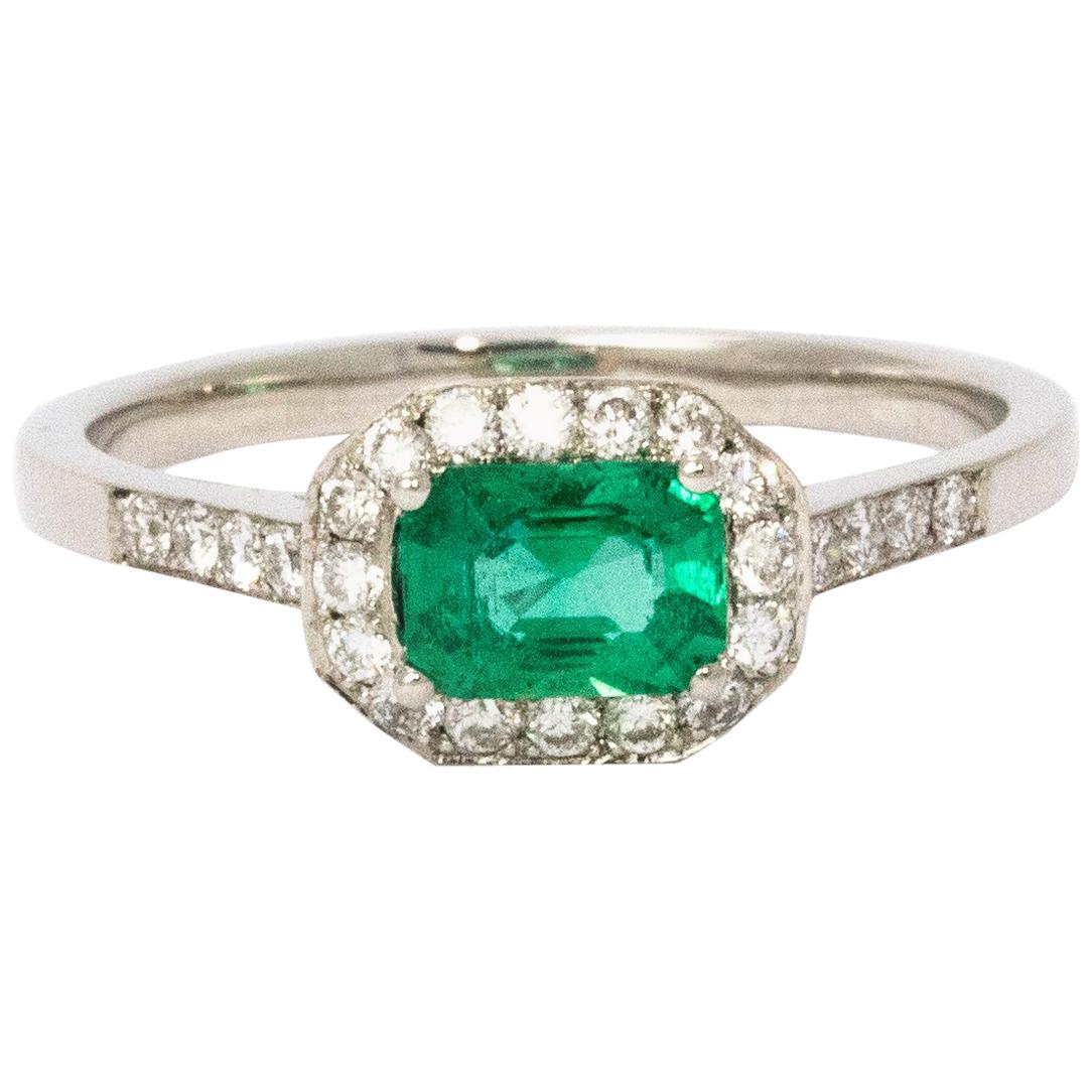 1960s Emerald Diamond Halo Platinum Ring