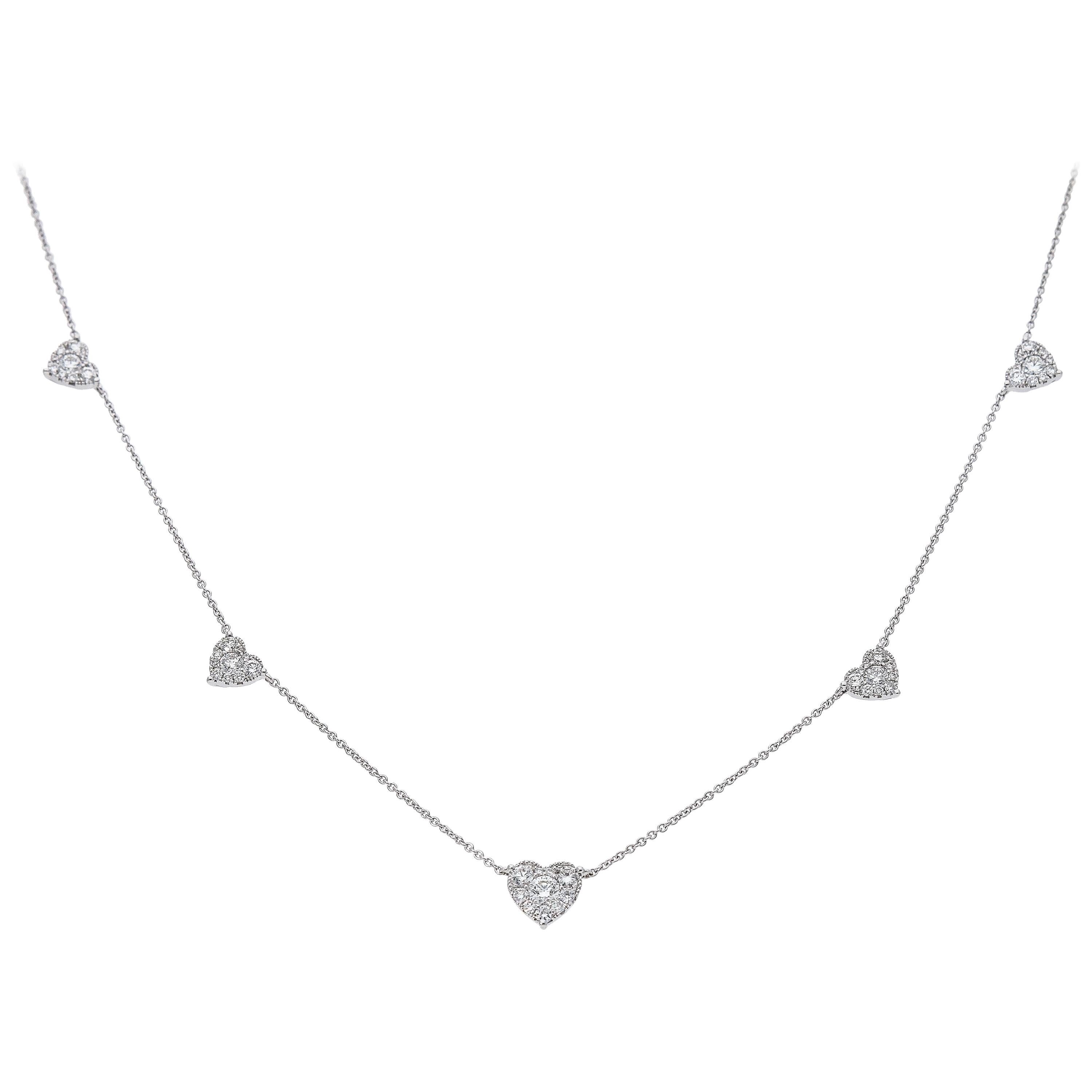 Chaîne collier en or blanc 18 carats avec cinq pendentifs en forme de cœur et diamants