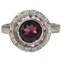 Anello con diamante e granato rodolite