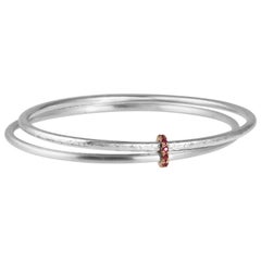 Sterling Silver Twin Bangles Interlinked with 18 Karat Rose Gold and Pink Rubies