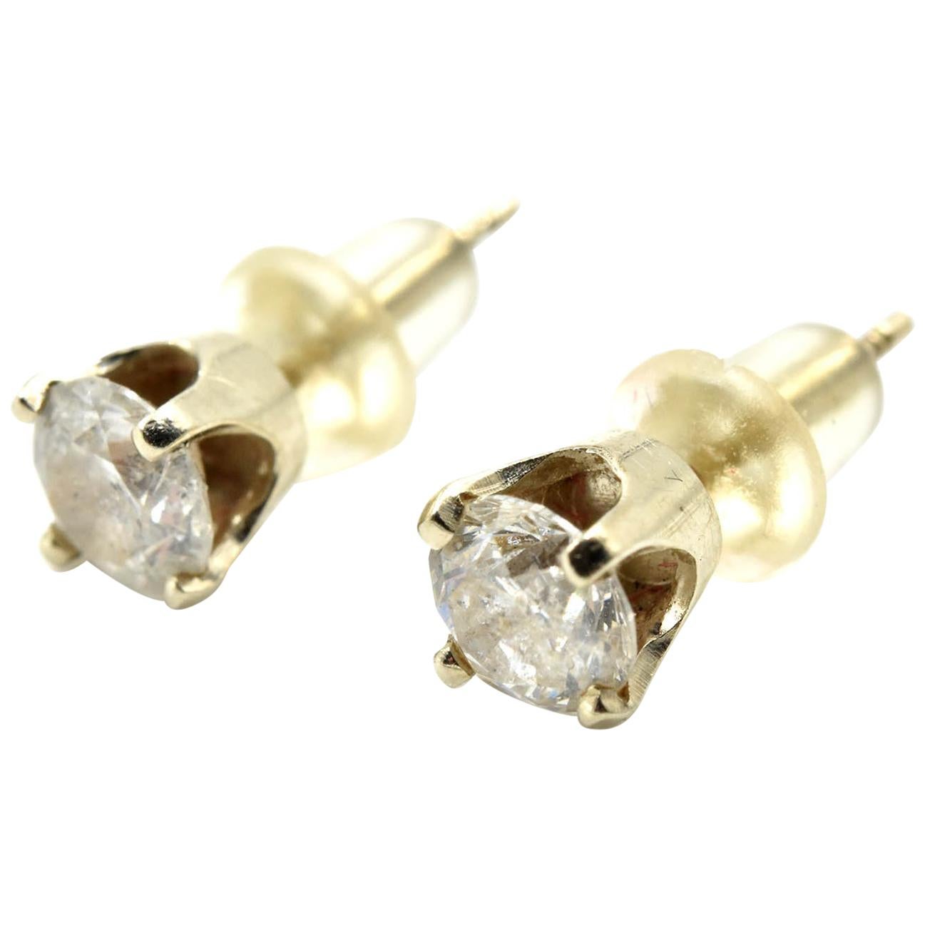 0.66 Carat Round Brilliant Diamond Stud Earrings 14 Karat Yellow Gold For Sale