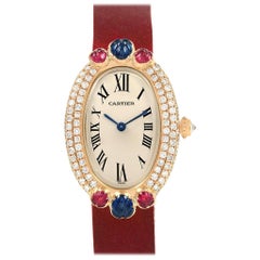 Montre Cartier Baignoire Tutti Frutti en or jaune Rubis Saphir Diamant