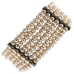  Bracelet perlé en or rose, diamants et petites perles roses 23,40 g