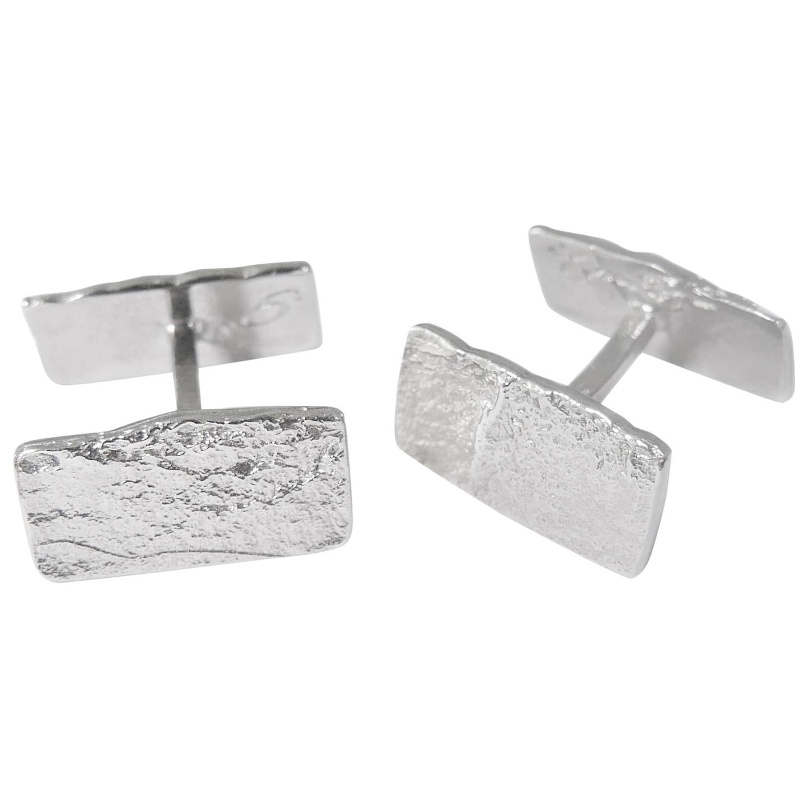 These minimalist cufflinks are crafted in solid sterling silver featuring the rustic texture of handmade paper. Designed to lie flat against the cuff for subtle impact. 

Every piece in Allison Bryan's Paper collection is individually hand-crafted