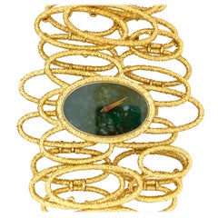 Piaget Vintage Cuff Watch in 18 Karat Yellow Gold with a Malachite Stone