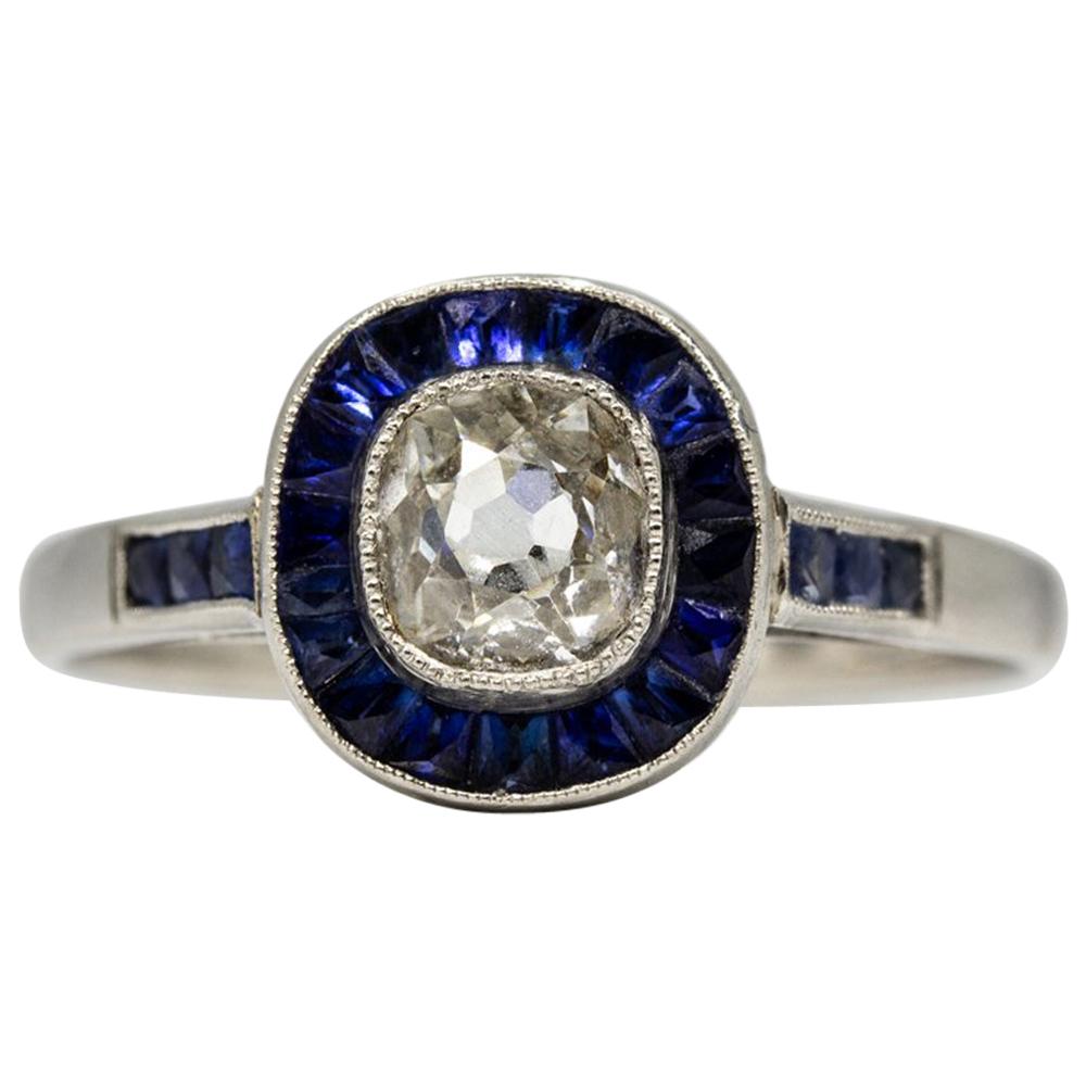 Glowing Platinum Diamond and Sapphires Halo Ring