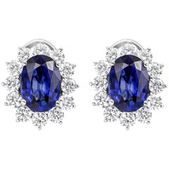 Roman Malakov, Oval Cut Blue Sapphire and Diamond Halo Omega Clip Earrings