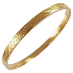 Art Deco Engine Turned 15 Karat Yellow Gold Flapper Bangle, London, 1927