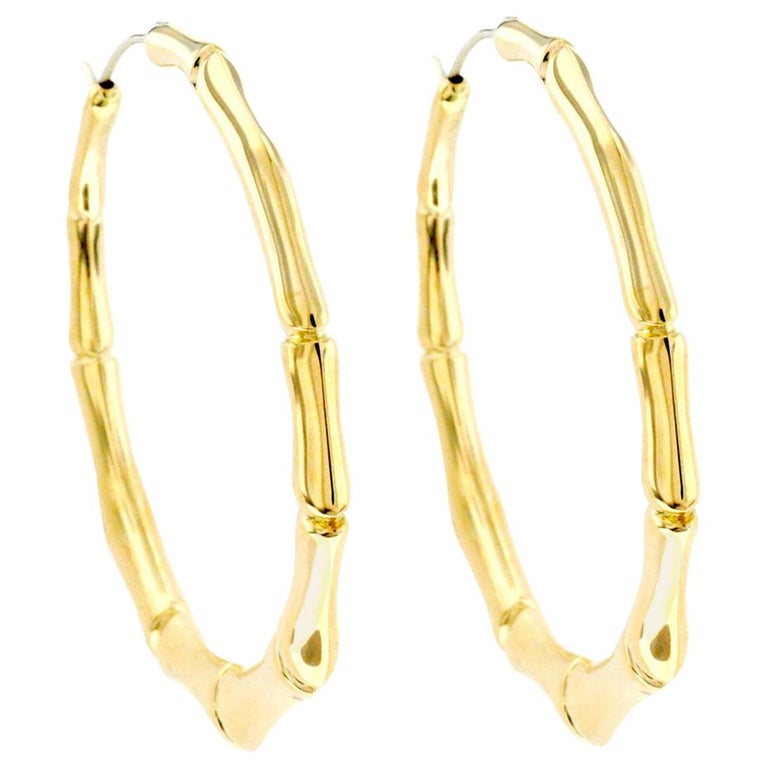 Gucci 18 Karat Yellow Gold Large Bamboo Hoop Earrings at 1stDibs | gucci  gold bamboo hoop earrings, gucci bamboo earrings, large bamboo earrings