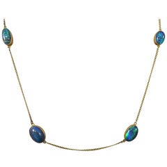 Antique Edwardian Long 15 Carat Yellow Gold Chain Necklace with Four Black Opal Stones