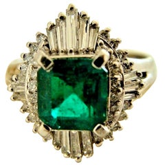 Retro Emerald Diamond Platinum Engagement Ring