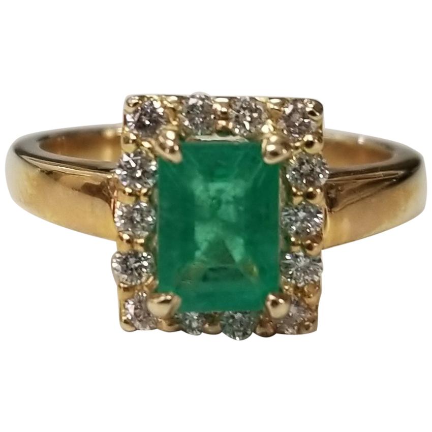 14 Karat Yellow Gold Emerald Cut Emerald and Diamond Ring For Sale