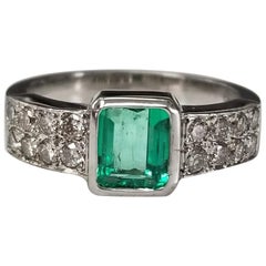 Retro 14 Karat White Gold Emerald Cut Emerald and Diamond Ring